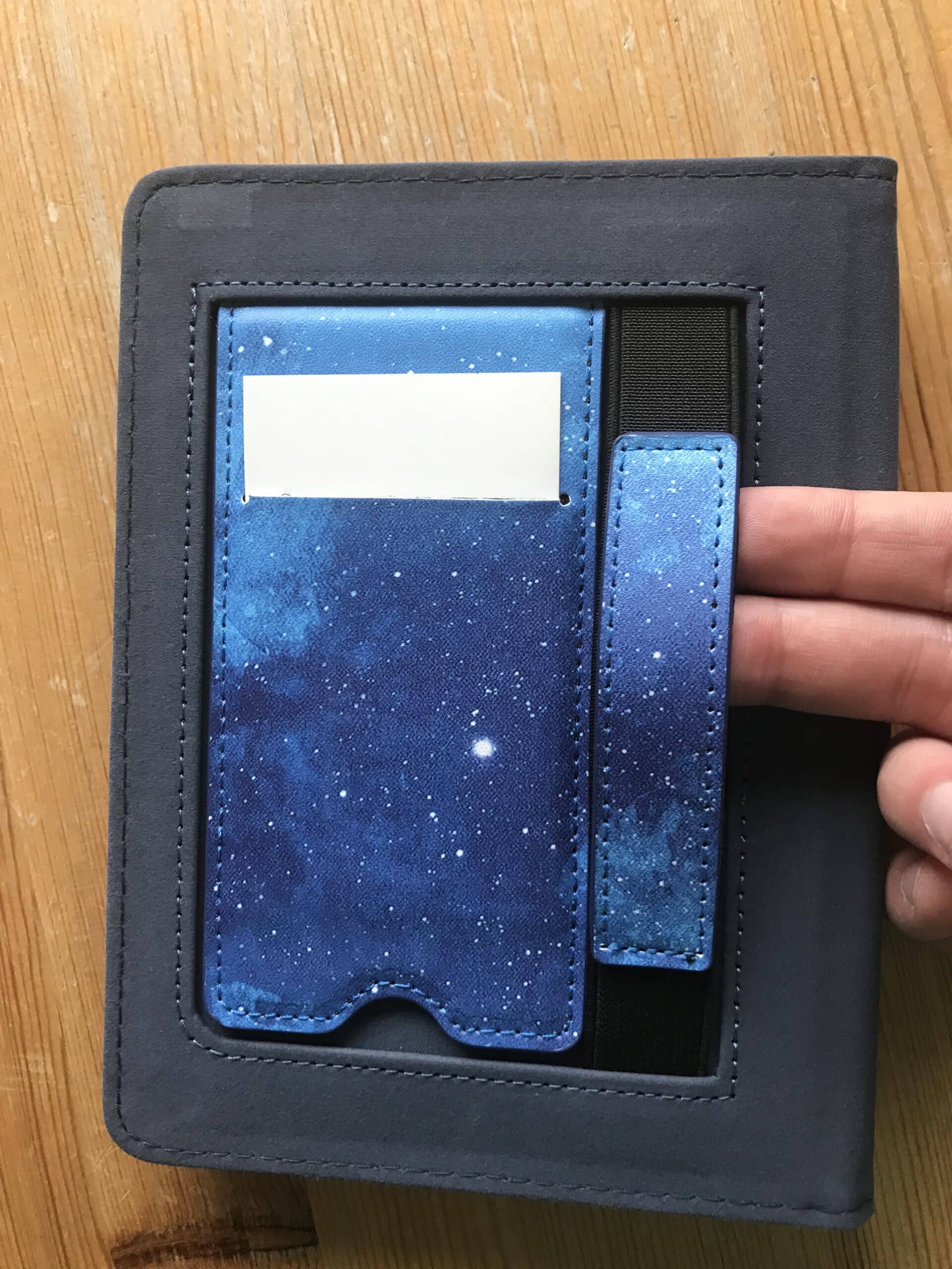 Photo showing card holder and elastic band inside Fintie Z-Starry Sky Cover