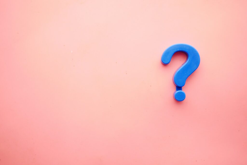 Image showing a blue question mark on a pink background