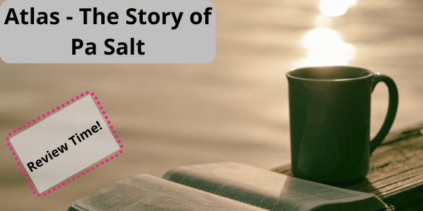 Image of a ceramic cup, a book and the test Atlas - The Story of Pa Salt written.