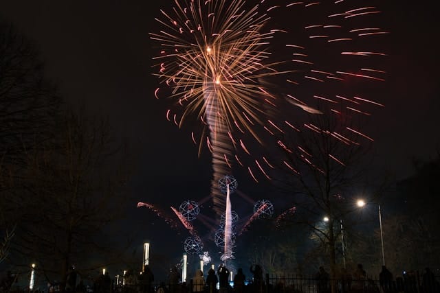 A large fireworks display in the night sky.