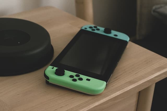 A green handheld gaming device